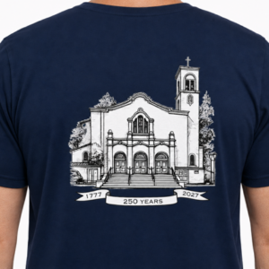 Person wearing a blue tshirt with the Saint Clare Logo.
